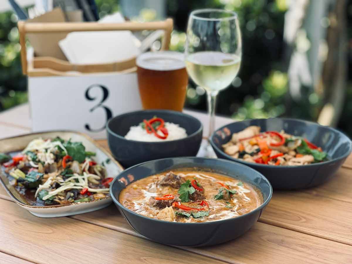 Asian meal in Asian dishes in outdoor setting