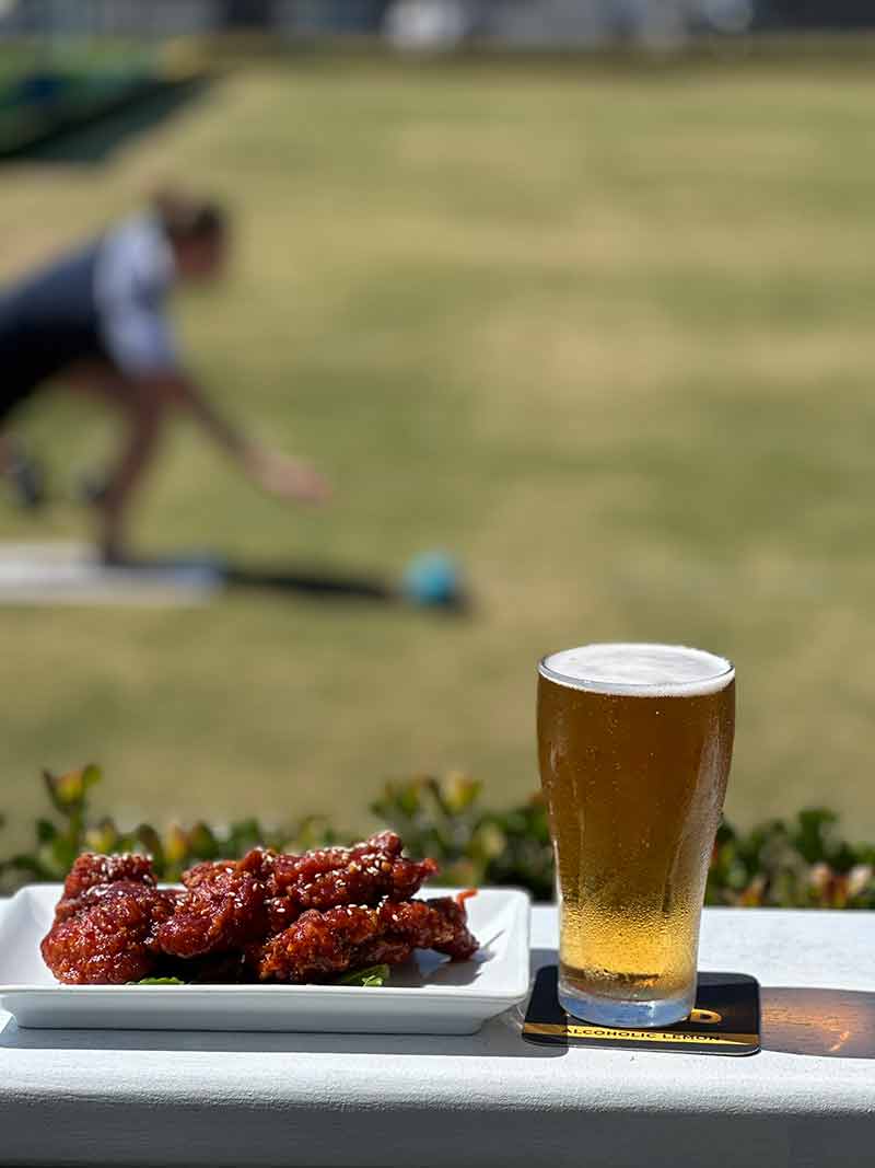 barefoot bowler in background